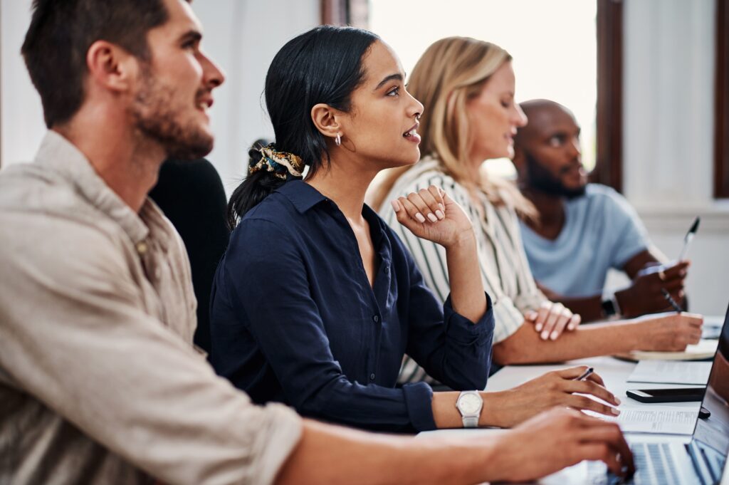 Business people listening to a seminar about career development.