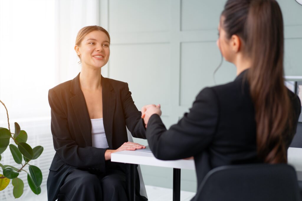 A young woman accepting a full-time job offer.